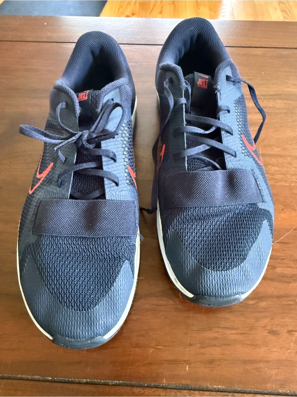 Nike Men’s Navy Sneakers with Red Swoosh Accents